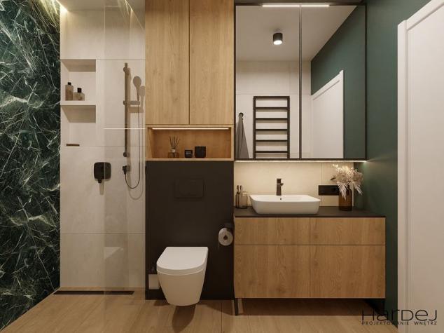 łazienka zielone płytki szafki laminat drewniany